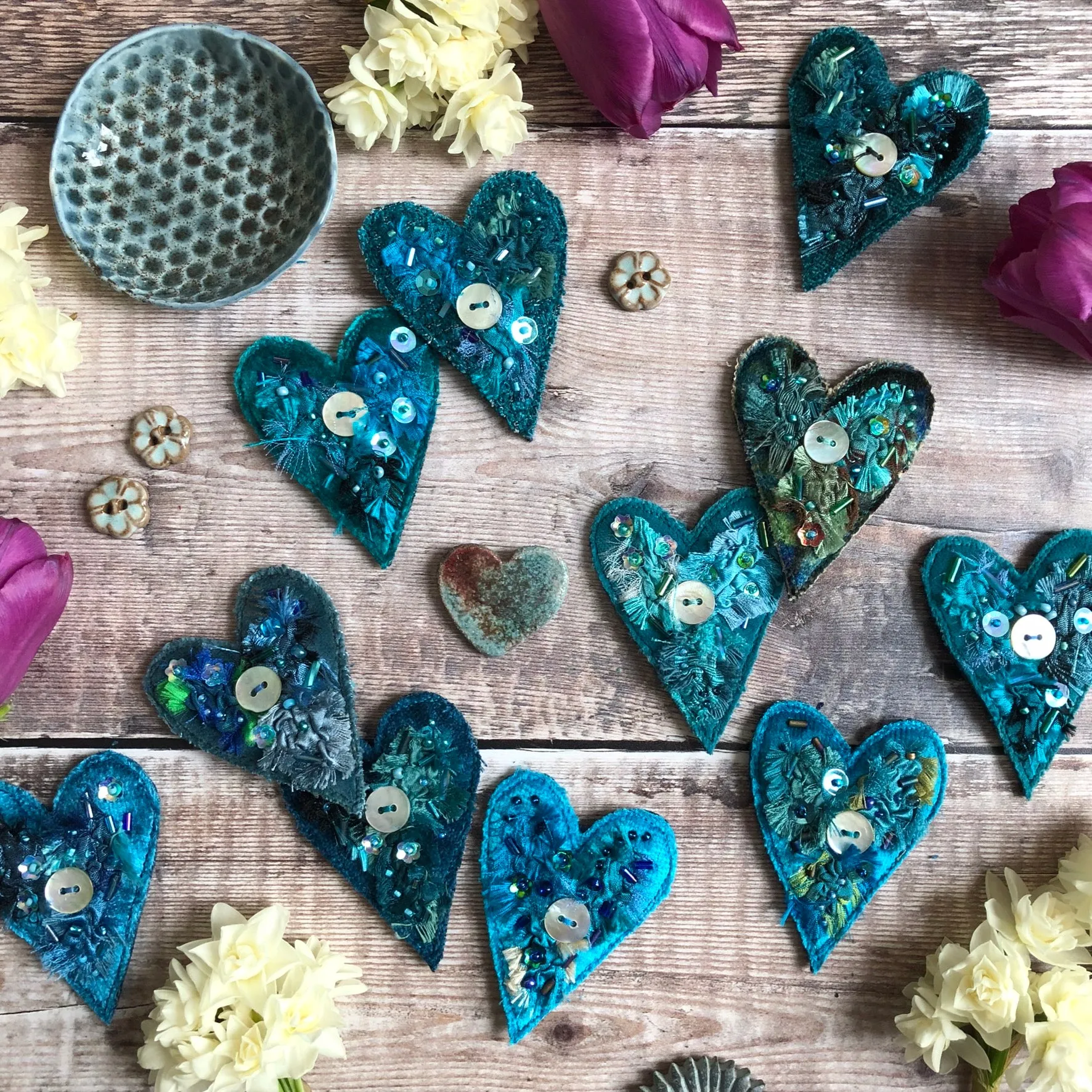 Fabric heart brooches in blues