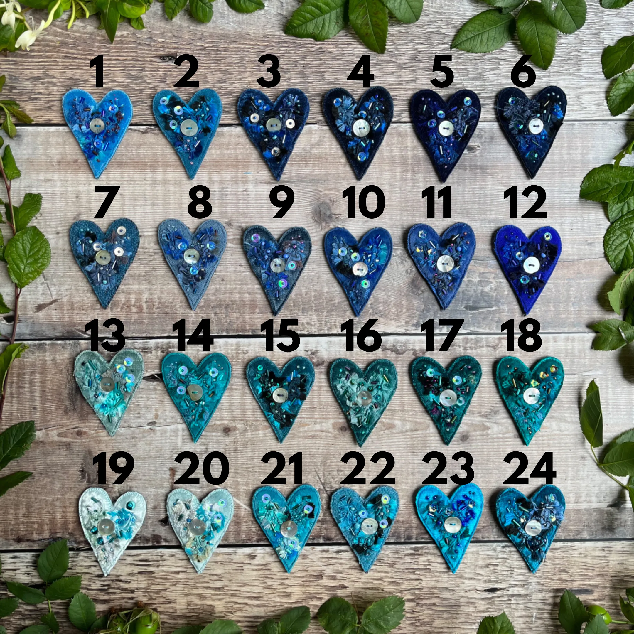 Fabric heart brooches in blues